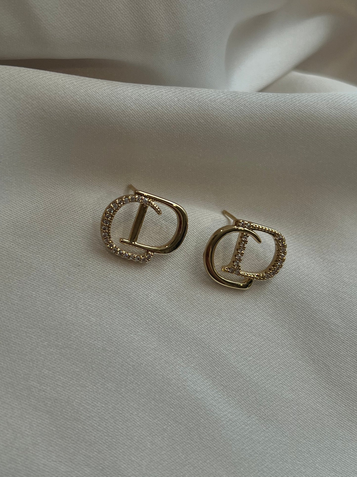Gold stud earrings