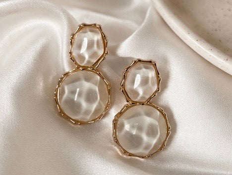 Lumina Drops gold statement earrings featuring luminous textured ivory stones on ivory satin fabric.  
Perfect for weddings, special occasions, vacations and elevated everyday wear
